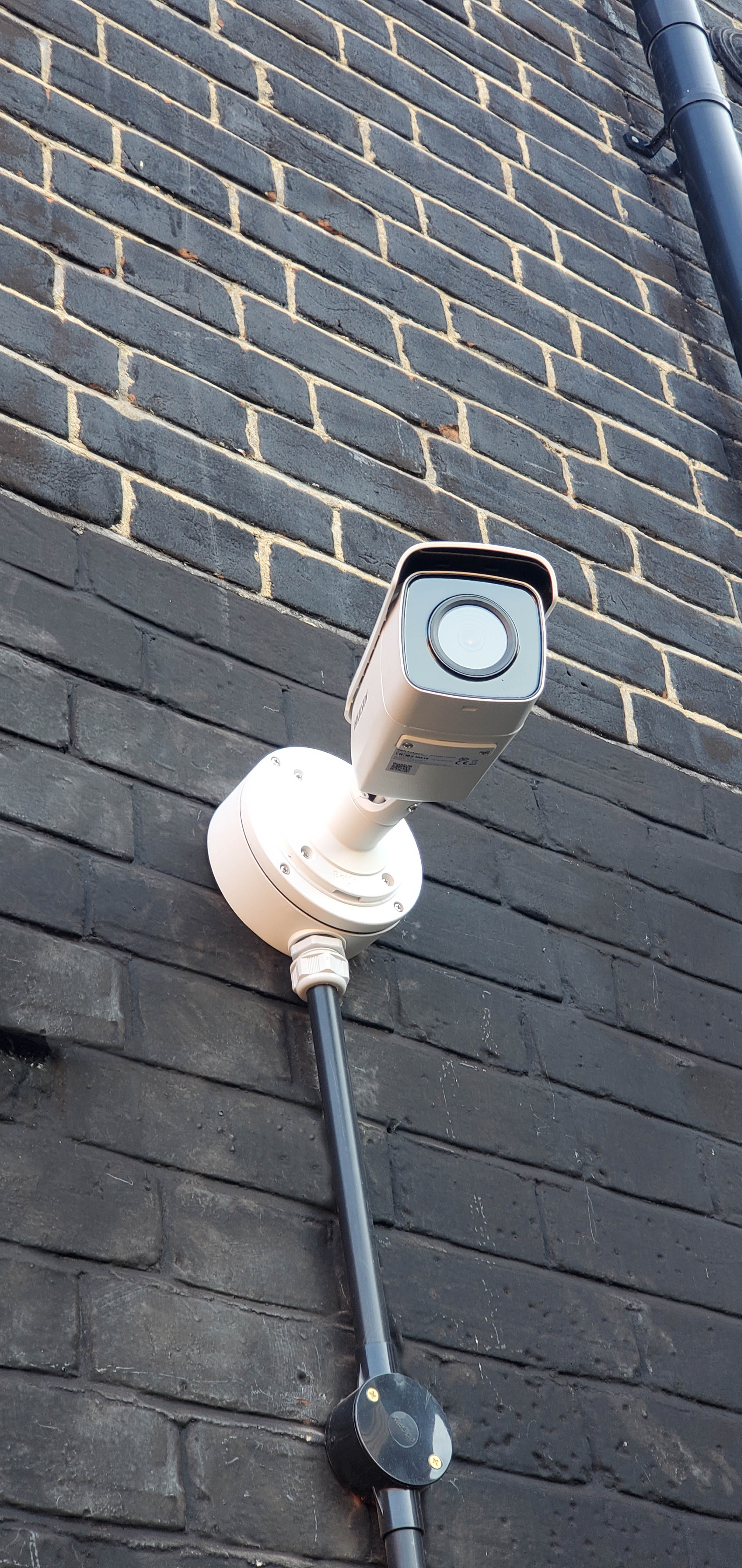 CCTV camera bolted to wall